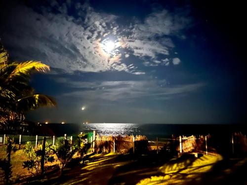 a view of the beach at night with the moon at Stonewater Beach Villa, Negombo in Mahawatta