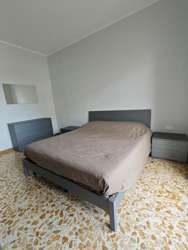 a bedroom with a bed in a room at Torino Cozy Lodge in Turin