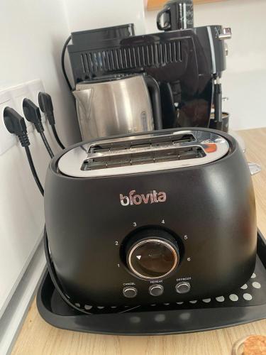 a black blender sitting on top of a counter at Malina Residence Aparthotel in Cisnădie