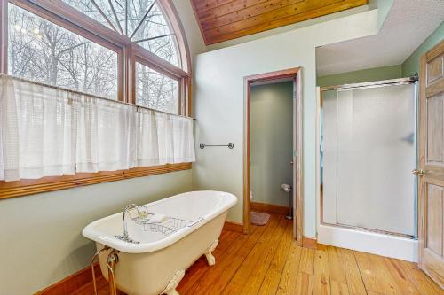 a bath tub in a bathroom with a window at Other Side of the Mountain in New Tazewell