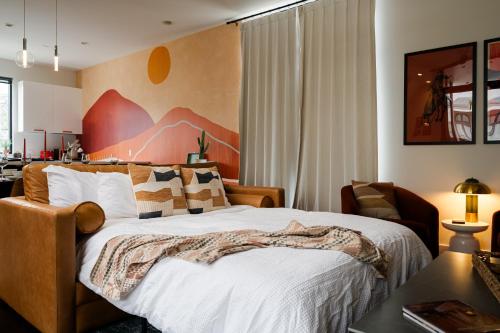 a bedroom with a large bed and a desk at Space City - Prof Design, Game Room, King BD in Houston