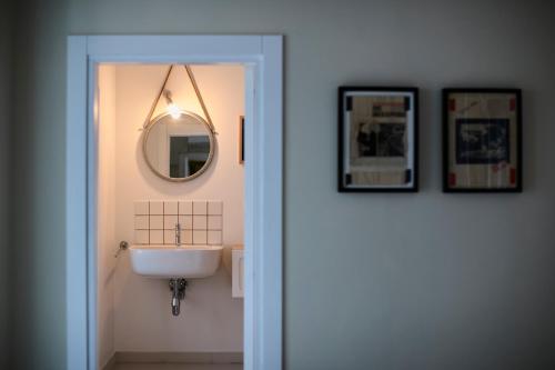 a bathroom with a sink and a mirror at B&B Casa Ninè in Gioia del Colle