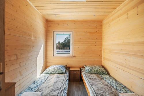 a sauna with two beds and a window at Sielsko-Anielsko Kobyla Góra V in Ligota