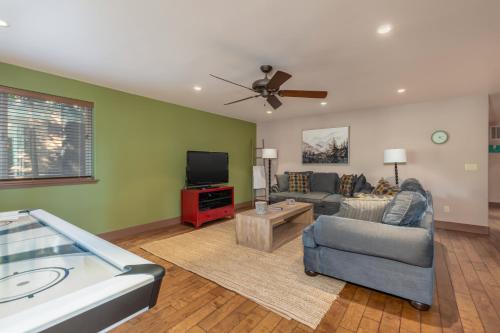 a living room with a couch and a tv at Wilsons Roost in Dorrington