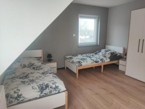 Postel nebo postele na pokoji v ubytování Ferienhaus Schöne Aussicht