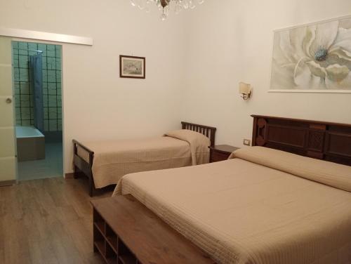 Ένα ή περισσότερα κρεβάτια σε δωμάτιο στο Civico 38