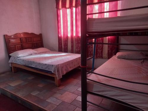 Кровать или кровати в номере Hostal Puntacana Vallarta