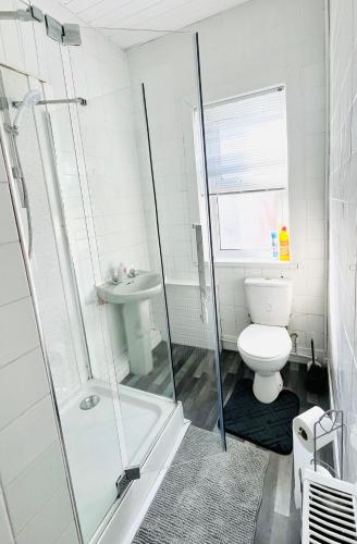 a bathroom with a shower and a toilet and a sink at Francis Avenue in Portsmouth