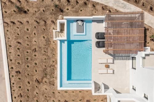 an overhead view of a building with a swimming pool at plaka riviera villa in Naxos Chora