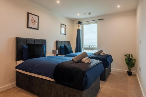 Postel nebo postele na pokoji v ubytování K Suites - Rivington Apartments