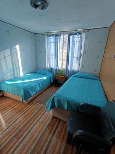 Postel nebo postele na pokoji v ubytování Hostal Caleta Abarca