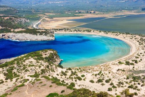 an aerial view of a beach with blue water at Finiki Plaza in Methoni