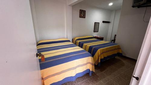 Postel nebo postele na pokoji v ubytování Hotel San Jose en Juquila
