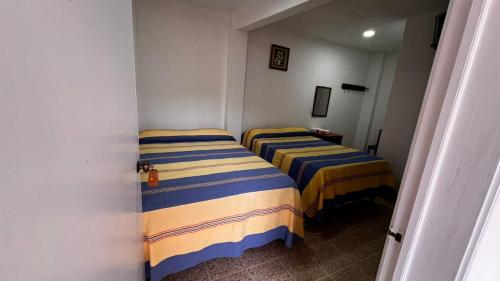 Postel nebo postele na pokoji v ubytování Hotel San Jose en Juquila
