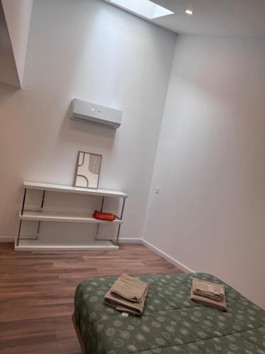 Ένα ή περισσότερα κρεβάτια σε δωμάτιο στο new very centric apartment