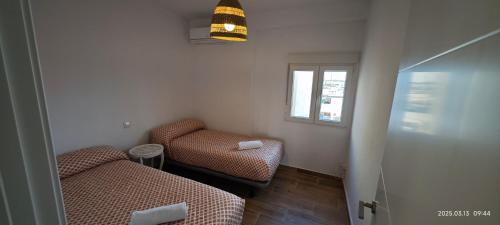 Cama o camas de una habitación en JEREZ CENTRO 5 DORMITORIOS TERRAZAS CON VISTAS ALCAZAR Y PLAZA ARENAL