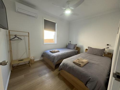Ένα ή περισσότερα κρεβάτια σε δωμάτιο στο Perrington Estate