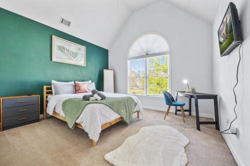 a bedroom with a bed with a teddy bear on it at Family-friendly Ellenwood Home with Parking & Deck in Ellenwood