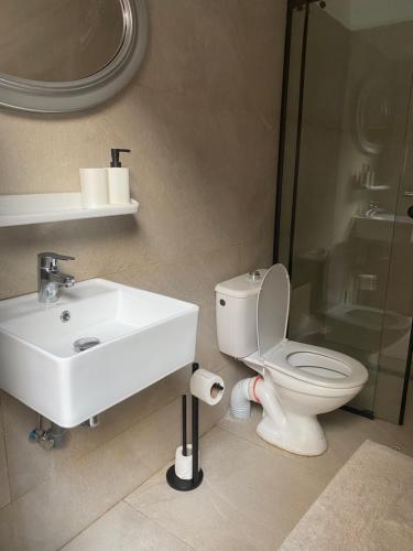 a bathroom with a sink and a toilet and a shower at Riad Lyna in Marrakech