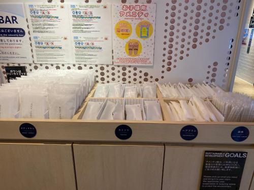 a display of rolls of toilet paper in a store at Henn na Hotel Komatsu Ekimae in Komatsu