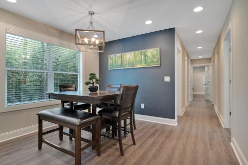 a dining room with a table and chairs at Spacious 4-bedroom Marietta Home w/ free parking in Marietta