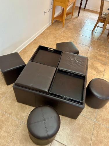 a brown table and chairs in a room at The Beach House Escape in Bradenton