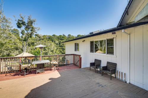 a deck with a table and chairs on a house at Aptos Home with Decks and Hot Tub - 2 Mi to Beach! in Aptos