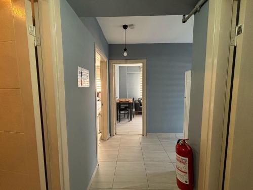 a hallway with a fire hydrant in a house at Zeus Suit Görükle in Nilüfer