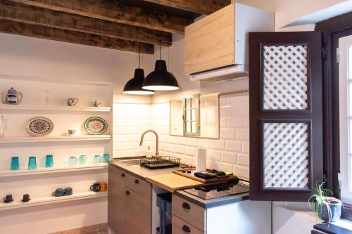 a kitchen with a sink and a counter top at Casa Mourisca - Albino d'Óbidos in Óbidos