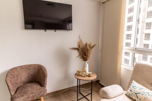 Apartamento via TERMALES Y LOS NEVADOSにあるテレビまたはエンターテインメントセンター