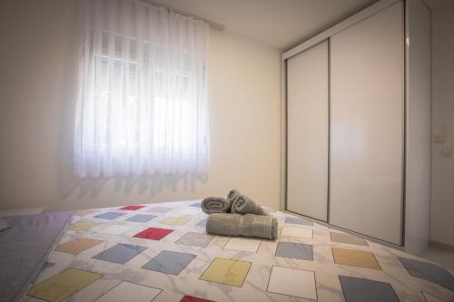Llit o llits en una habitació de Bubi Apartment
