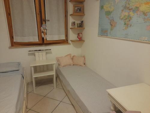 Postel nebo postele na pokoji v ubytování Casa dei glicini