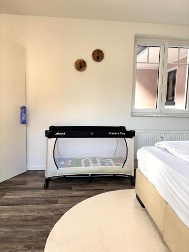 a bedroom with a bed and a large window at Im Herzen der Eifel - Entspannung pur in Hellenthal