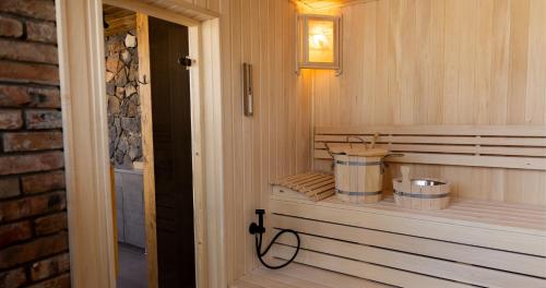 a room with a sauna with a bucket and a hose at Dilijani Tun Hotel & Restaurant in Dilijan