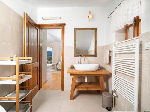 a bathroom with a sink and a mirror at Lavanda Mansion in Vodice