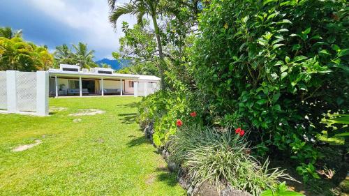 a house with a garden in front of it at TeMakatea Villa in Matavera