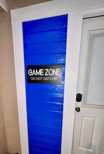 a blue door with a game zone sign on it at GameZone in Sparks