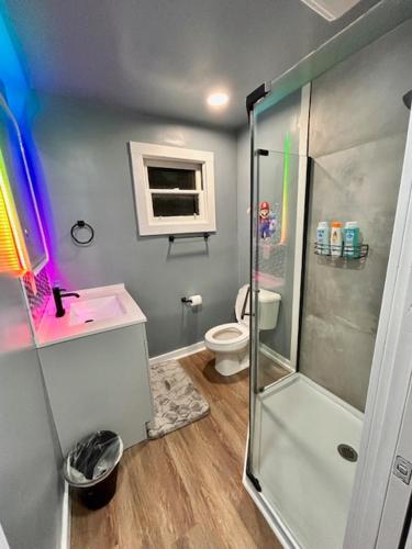 a bathroom with a shower and a toilet at GameZone in Sparks
