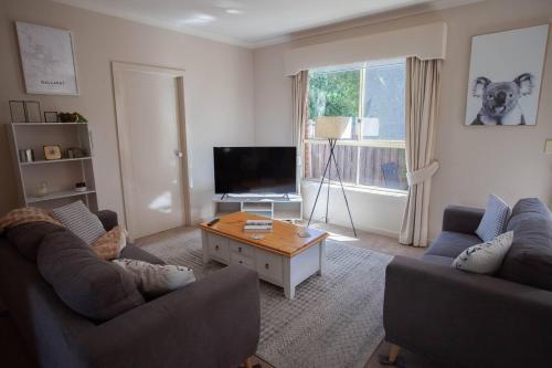a living room with two couches and a coffee table at Drummond Living Spacious 3BR Home in Town in Ballarat