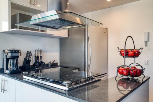 a kitchen with a stainless steel stove top oven at ULIV Polanco in Mexico City