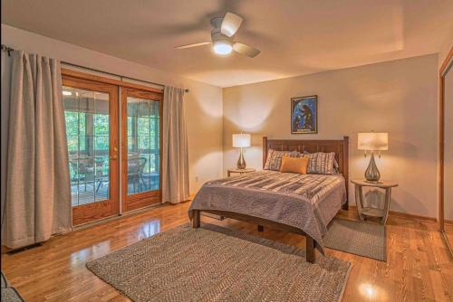 a bedroom with a bed and a large window at Mountain Peace in Townsend