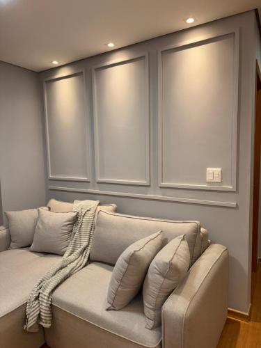 Et opholdsområde på Apartamento aconchegante