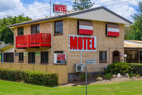 a motel sign on the side of a house at Goomeri Motel in Goomeri