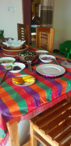 a colorful table with plates on a colorful table cloth at Vista villa in Panama