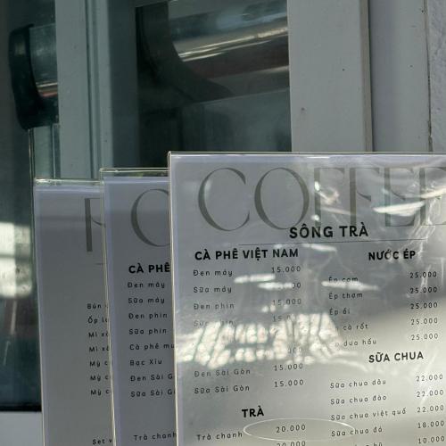a sign that says song taxi on a window at Khách sạn Lý Sơn in Ly Son