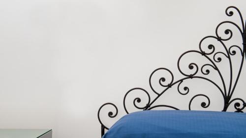 Ένα ή περισσότερα κρεβάτια σε δωμάτιο στο Albergo 'La Vigna'