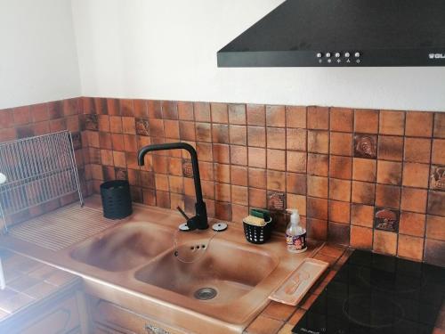 a kitchen sink with a faucet on top of it at Maison à Noirmoutier proche plage, animaux admis - FR-1-823-34 in Noirmoutier-en-l'lle