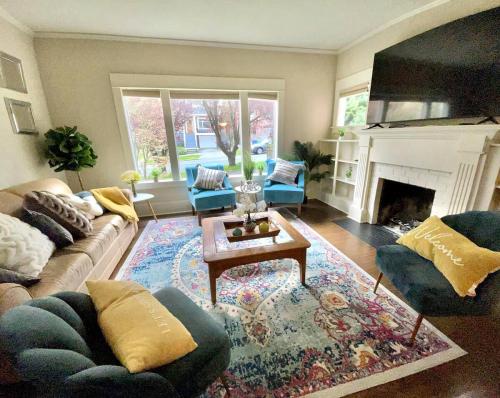 a living room with a couch and a fireplace at Seattle Escape Queen Anne w Private Deck in Seattle