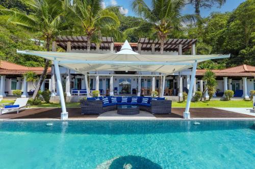 a gazebo next to a swimming pool at Spectacular Ocean Views 8BR Pool Villa Sawan in Patong! Relax & Play - Billiard, Table football, Gym & Sauna! in Patong Beach