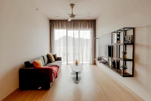 a living room with a couch and a table at Windmill Upon Hills Genting Highland in Genting Highlands